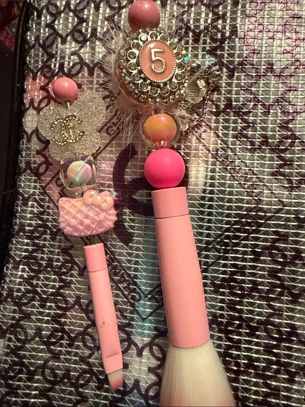 Pen/pencil or makeup brush holder along with brushes and pen and cosmetic case